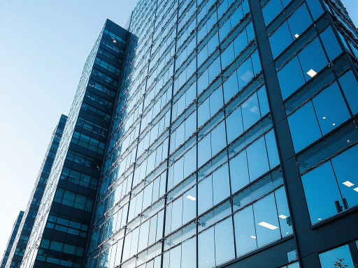 Modern technology company office building exterior view, glass facade architecture, professional corporate environment